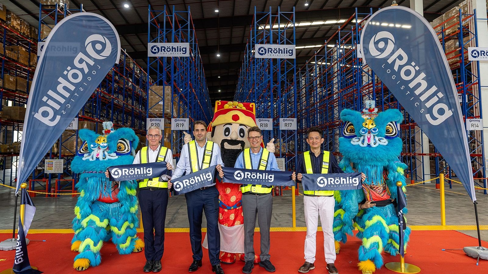Cutting the ribbon at röhlig malaysia warehouse